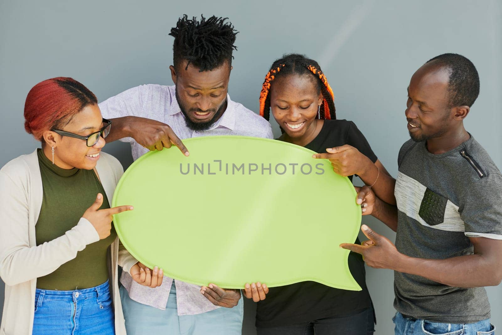 Young african american friends holding up copyspace placard thought bubbles by Prosto