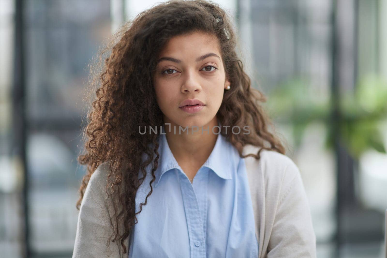 girl standing at modern office looking at camera