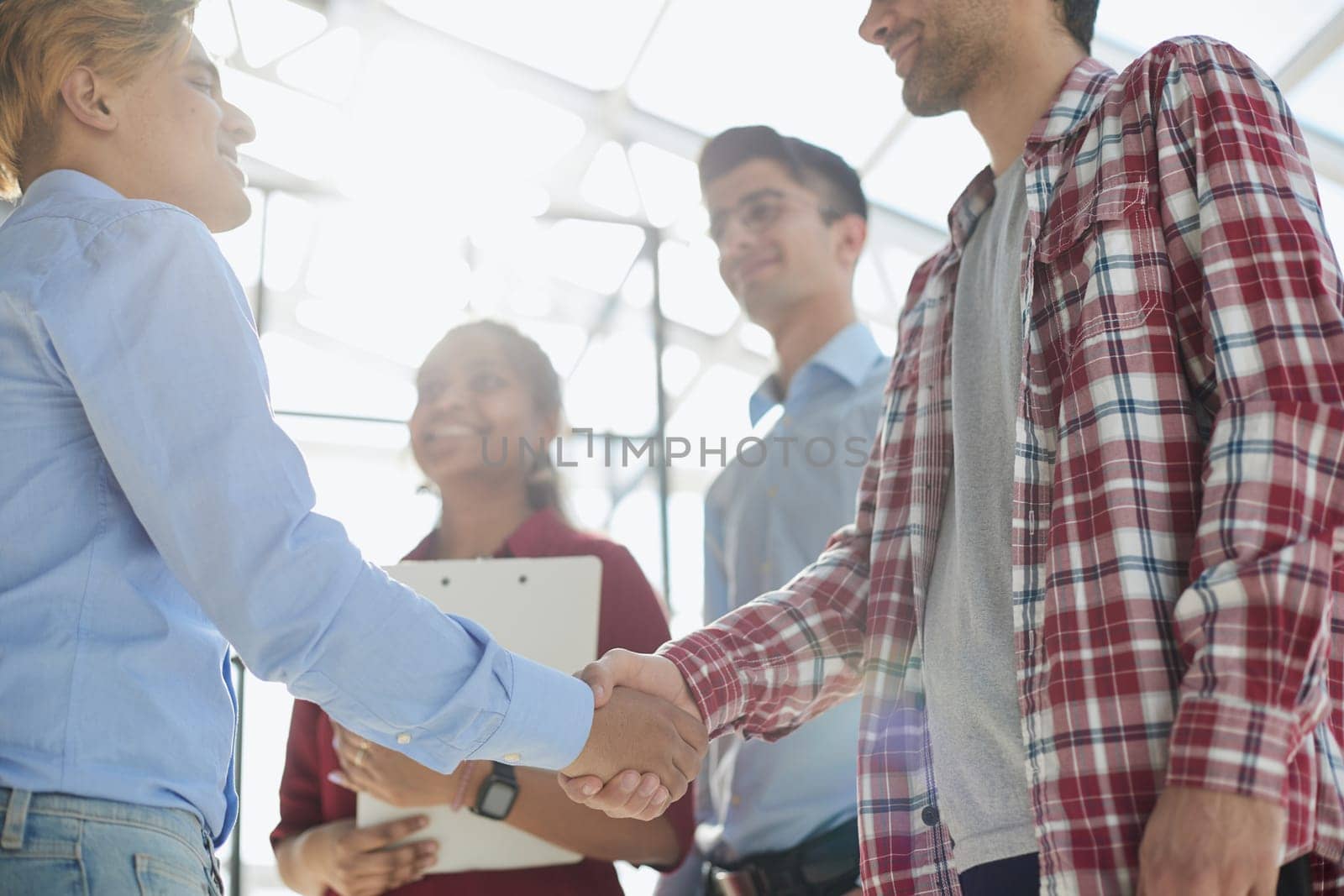 Portrait of a businessman and business woman discussing and cheering with agreement for success.