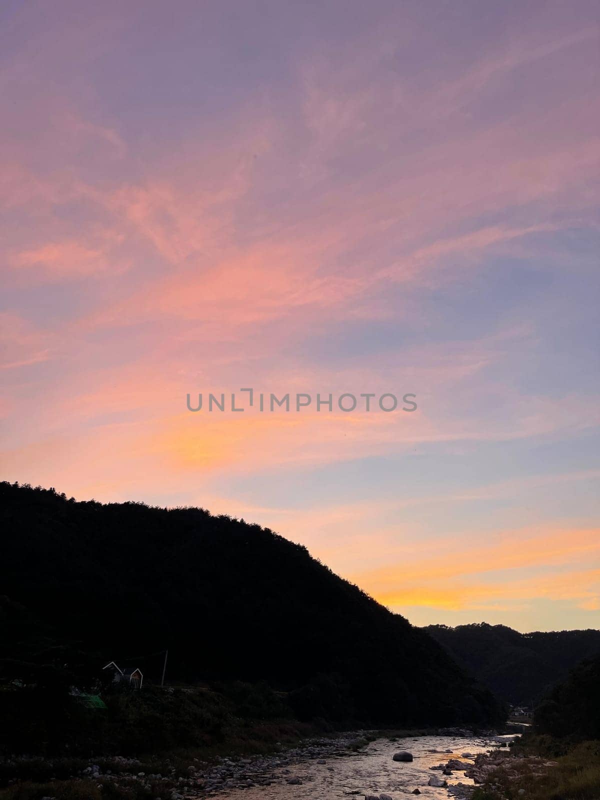 sky,afterglow,atmosphere,water,cloud,orange,mountain,highland,daytime,dusk,evening,hill,horizon,morning