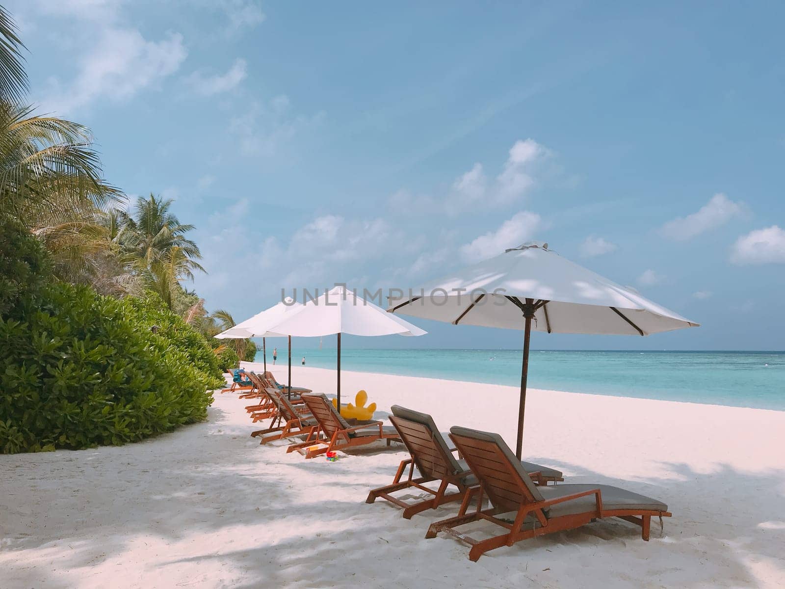 beach,furniture,leisure,ocean,resort,sea,shade,shore,sky,sunlounger,table,umbrella,vacation by ogqcorp