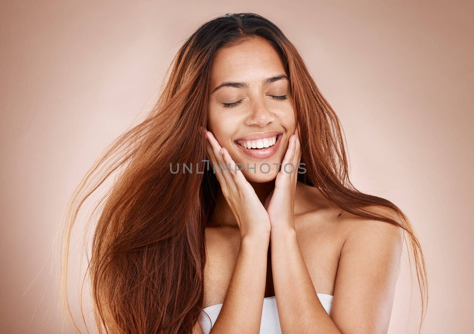 Beauty, hair care and face of woman with eyes closed in studio on brown background. Skincare, makeup cosmetics or female model satisfied with salon treatment for balayage hairstyle, growth or texture.
