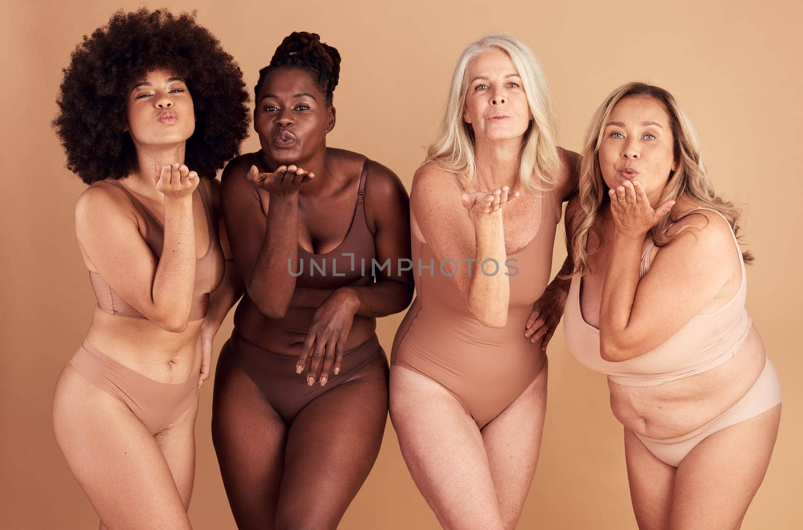 Women, body and different shape group blowing a kiss in studio for lingerie, beauty and diversity wearing underwear. Portrait of female friends together for body positivity, inclusion and self love.