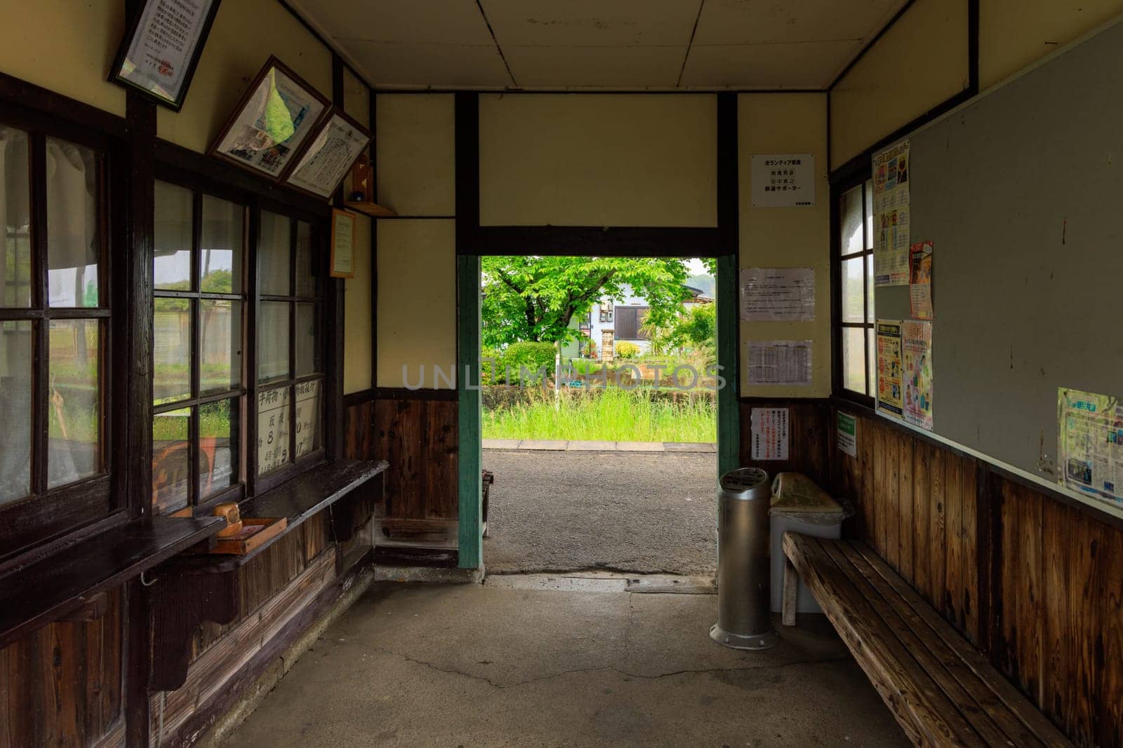 Hyogo, Japan - May 15, 2023: Unmanned ticket counter and waiting room in historic rural train station by Osaze