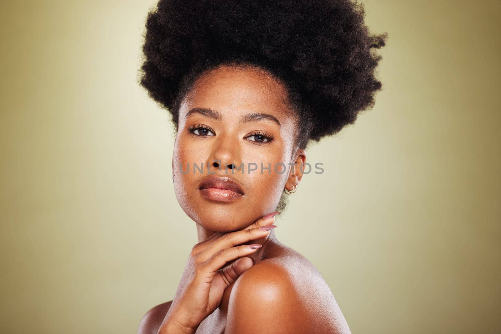 Black woman, portrait and beauty with skincare, hair care and cosmetic makeup in studio background. Model, afro and aesthetic with skin wellness or cosmetics for healthy facial texture and hygiene by YuriArcurs