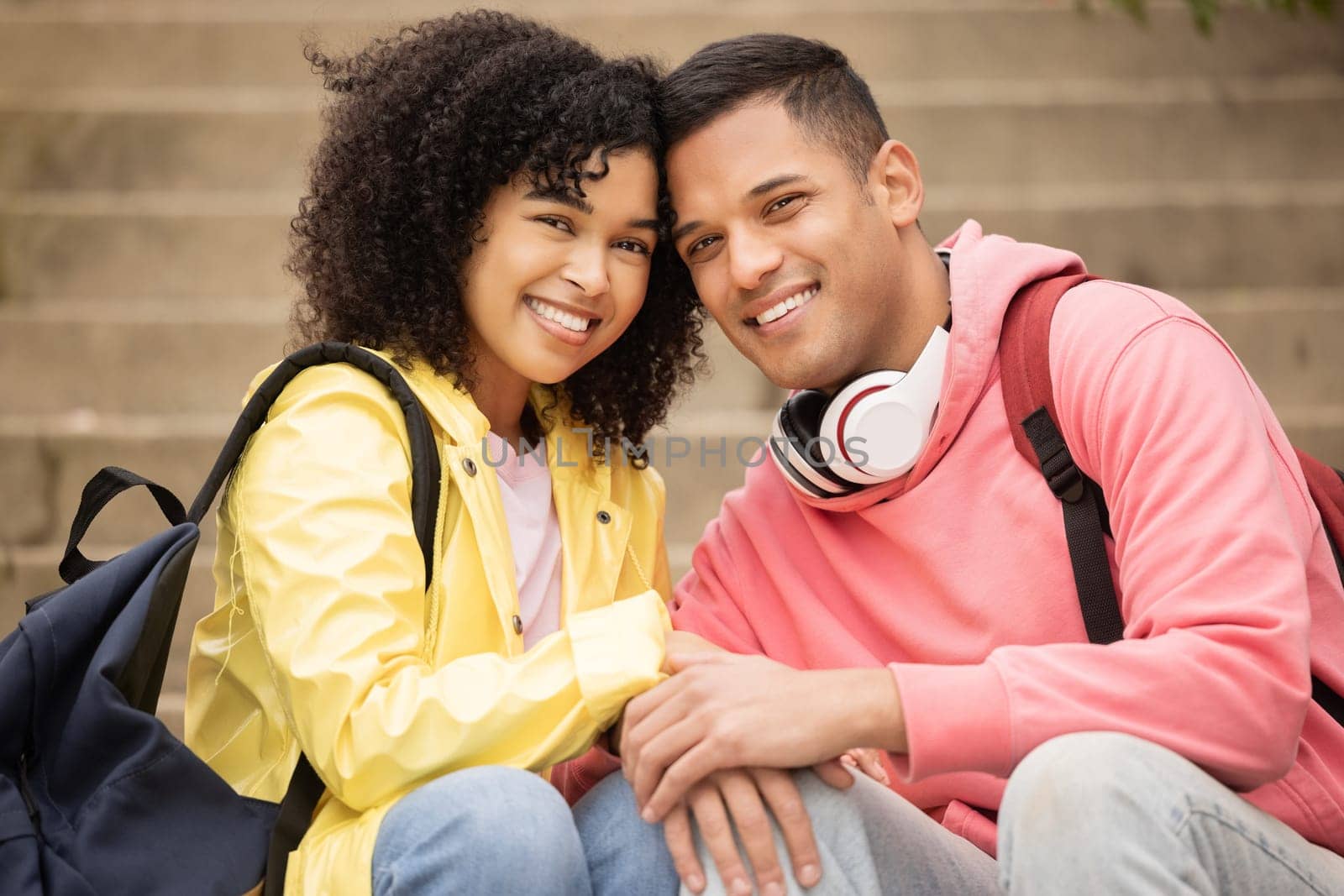 Portrait, learning and stairs with student black couple sitting outdoor together on university campus. Love, education and college with a man and woman bonding on steps while relaxing outside by YuriArcurs