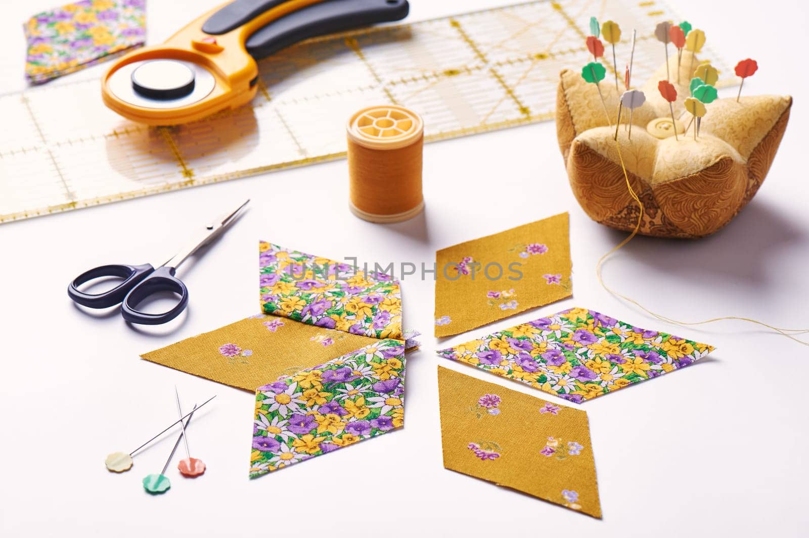Design  element of  quilt in progress, prepared cut pieces and sew one around accessories, patchwork