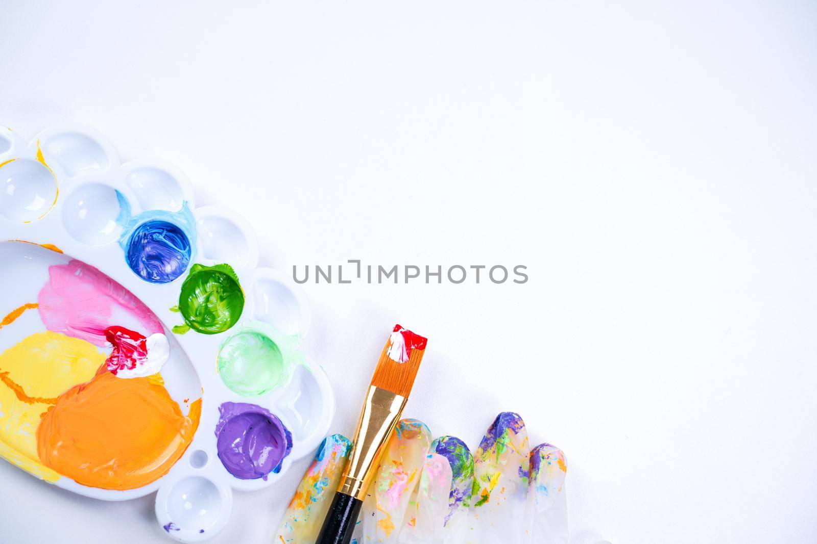 Design concept - Preparing for Easter celebration, painting Easter eggs with colorful Acrylic pigment color dyestuff in palette, close up, lifestyle.