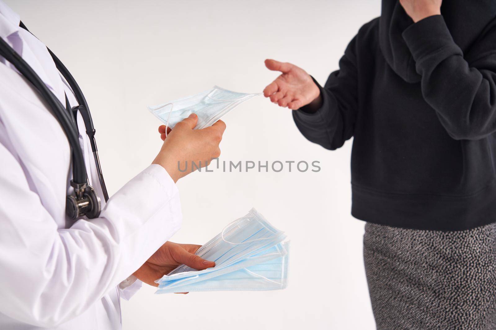 Doctor or nurse recommend to use protective face mask to protect from virus infection