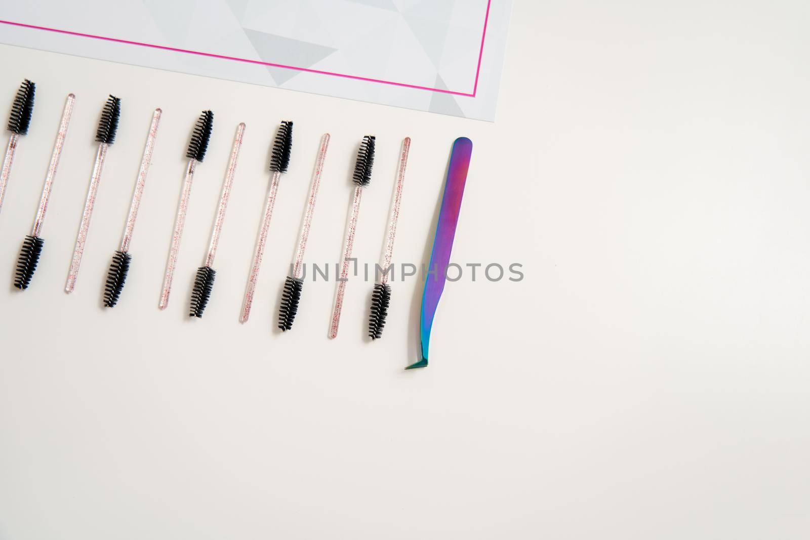 eyelash brushes on a white background with copyspace