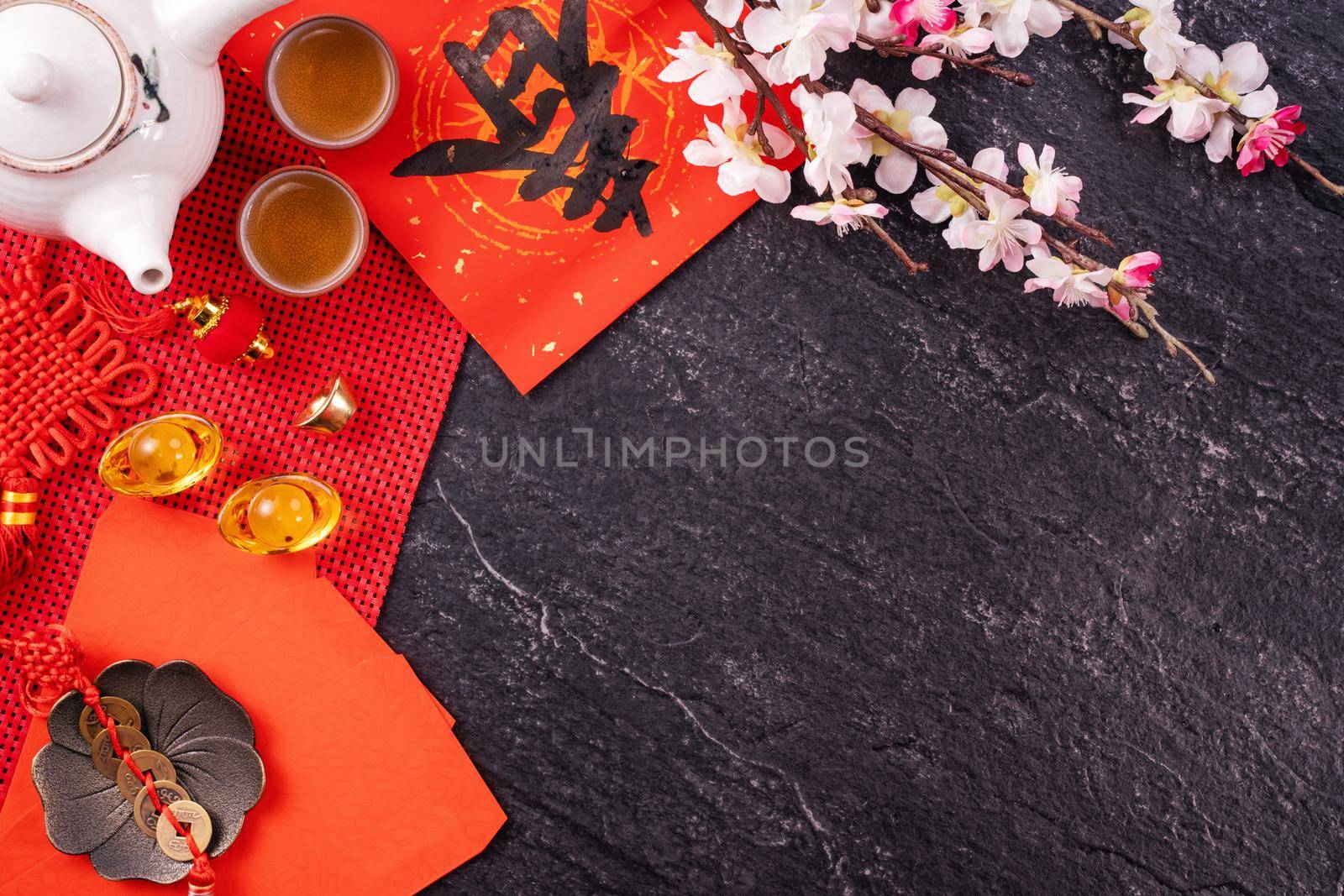Design concept of Chinese lunar January new year - Festive accessories, red envelopes (ang pow, hong bao), top view, flat lay, overhead above. The word 'chun' means coming spring. by ROMIXIMAGE