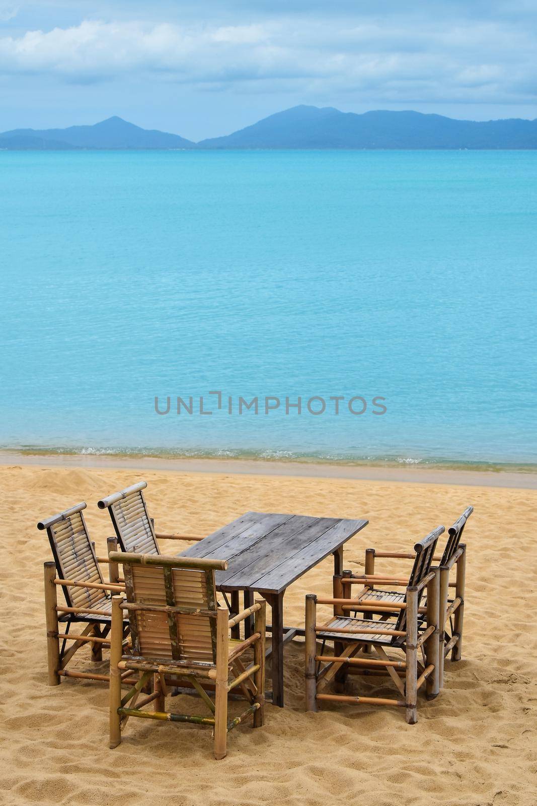 Wooden bamboo furniture on sand beach by BreakingTheWalls