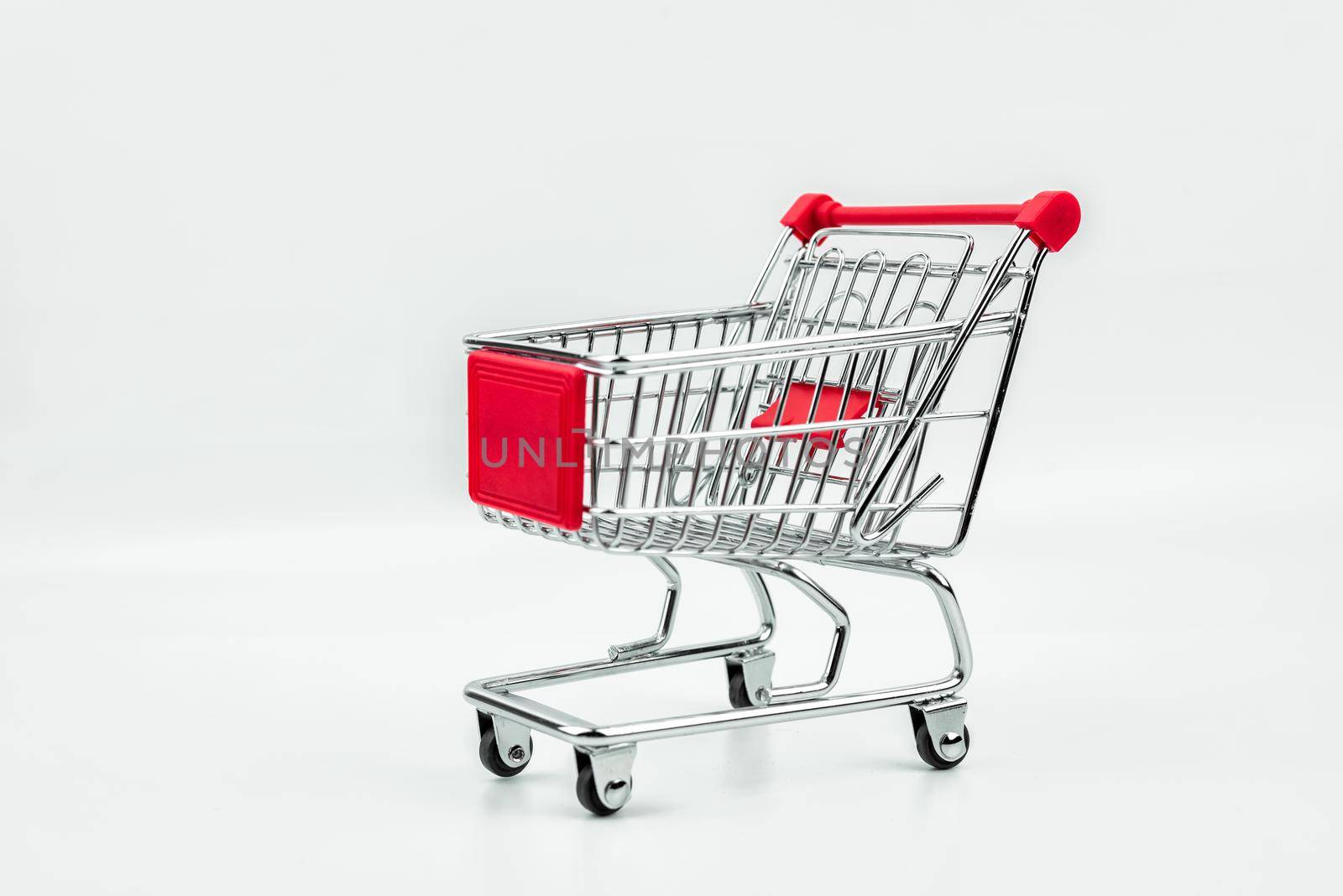 close up of shopping cart isolated on white background by Wmpix
