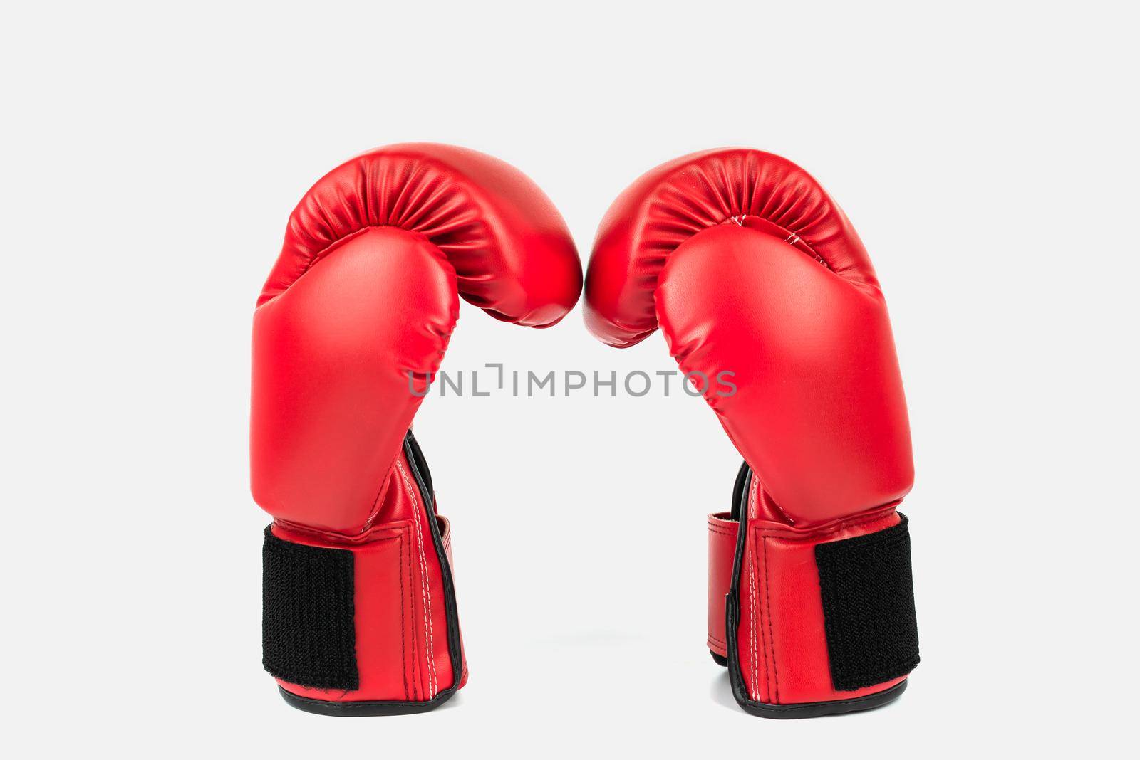 Red leather boxing gloves isolated on white background