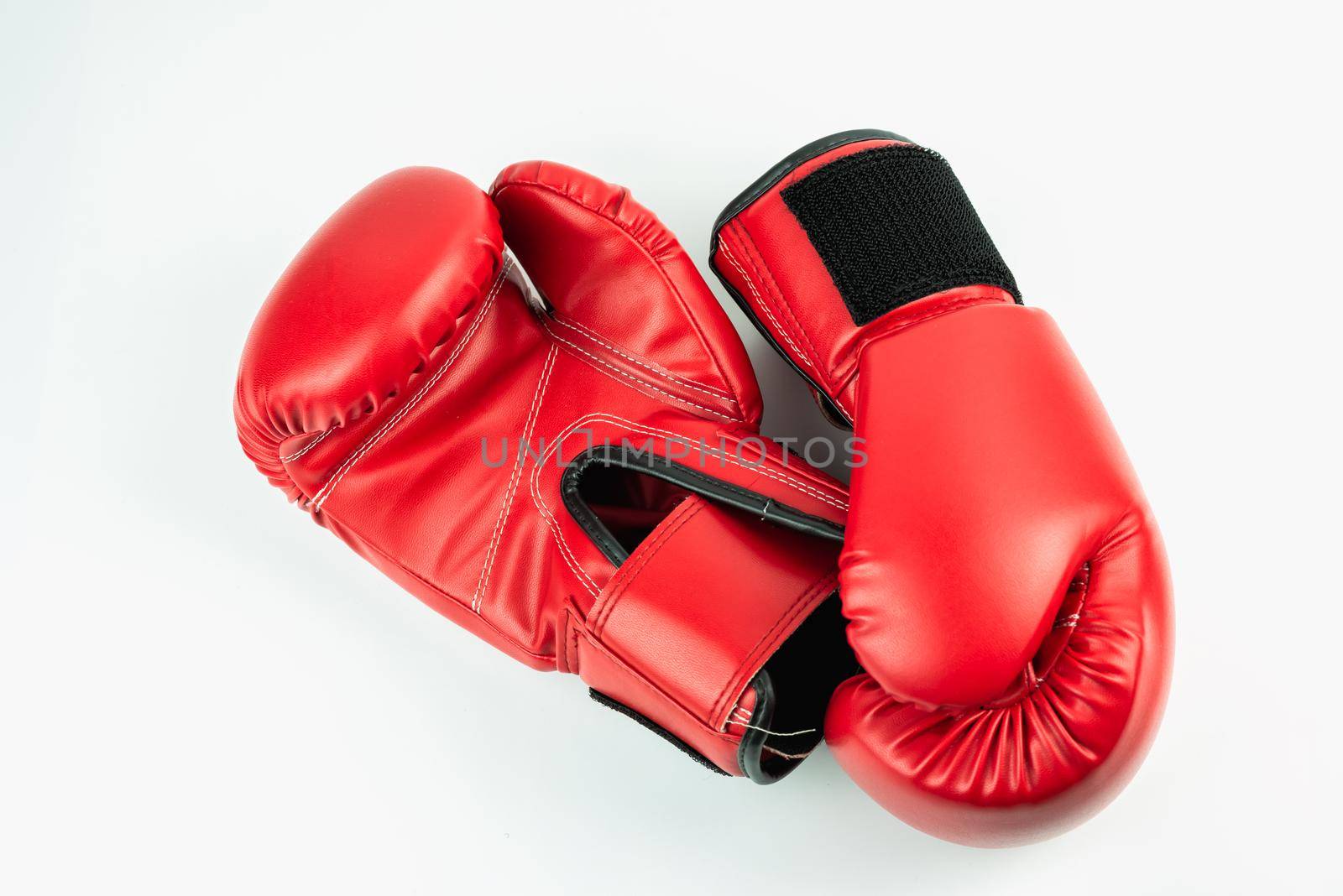 Red leather boxing gloves isolated on white background by Wmpix