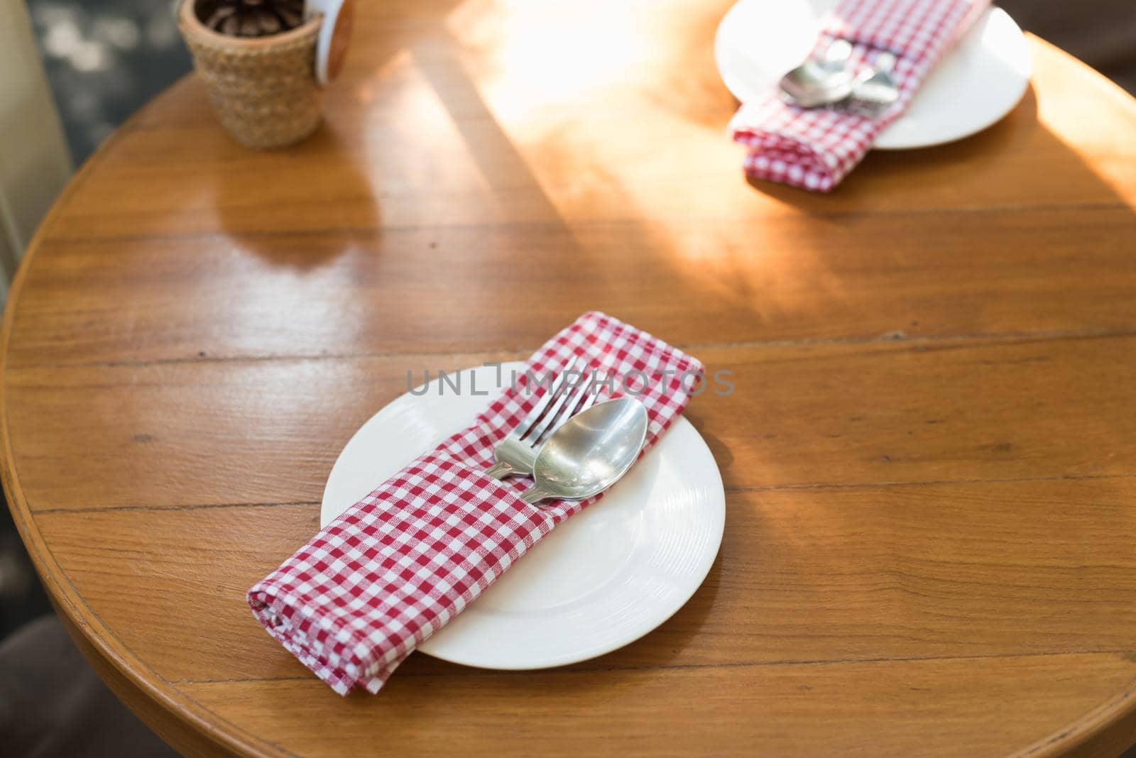 spoon and fork on wood table by Wmpix