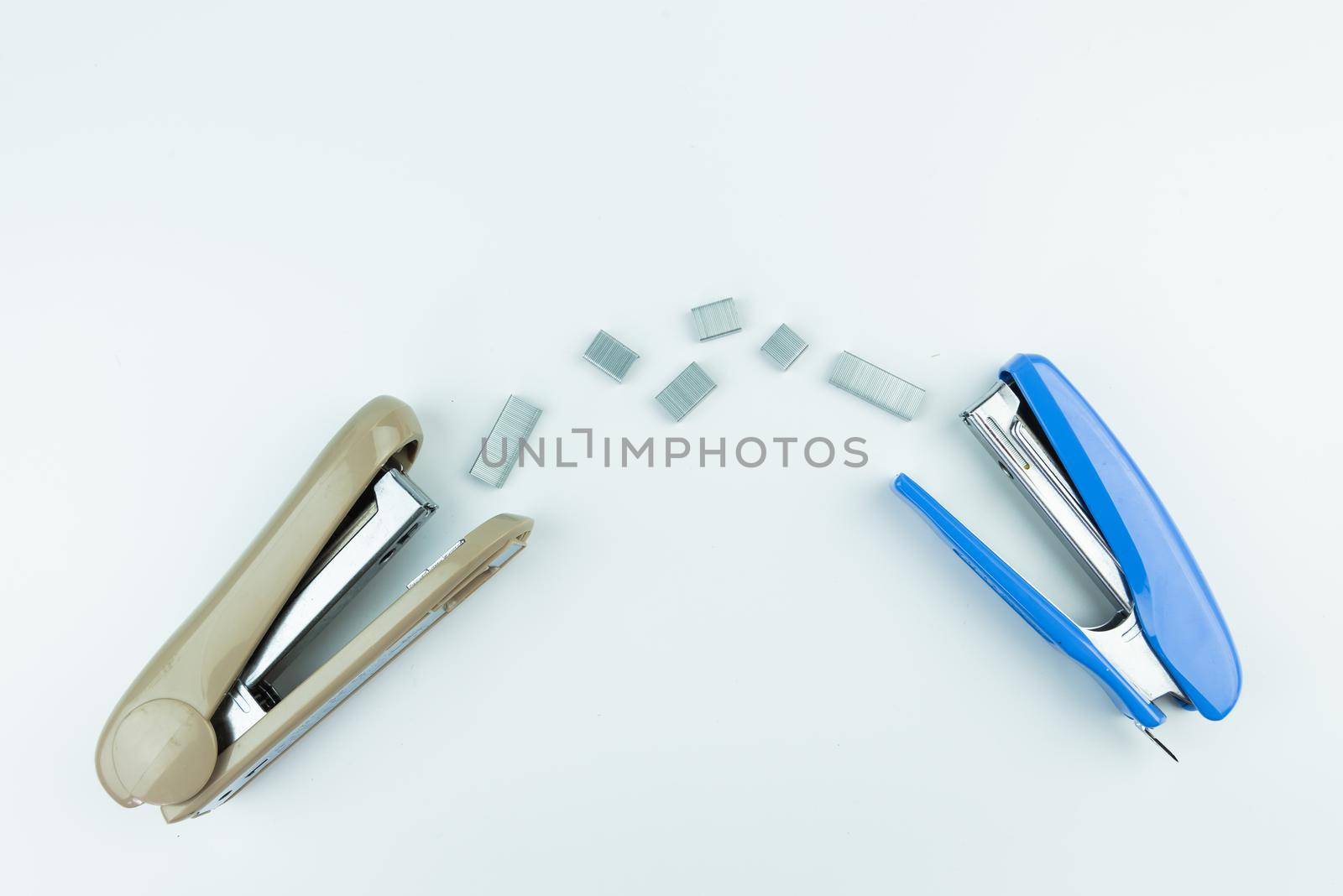 metal stapler with staples isolated on white background.