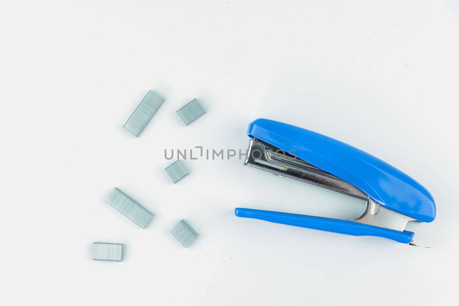 metal stapler with staples isolated on white background.