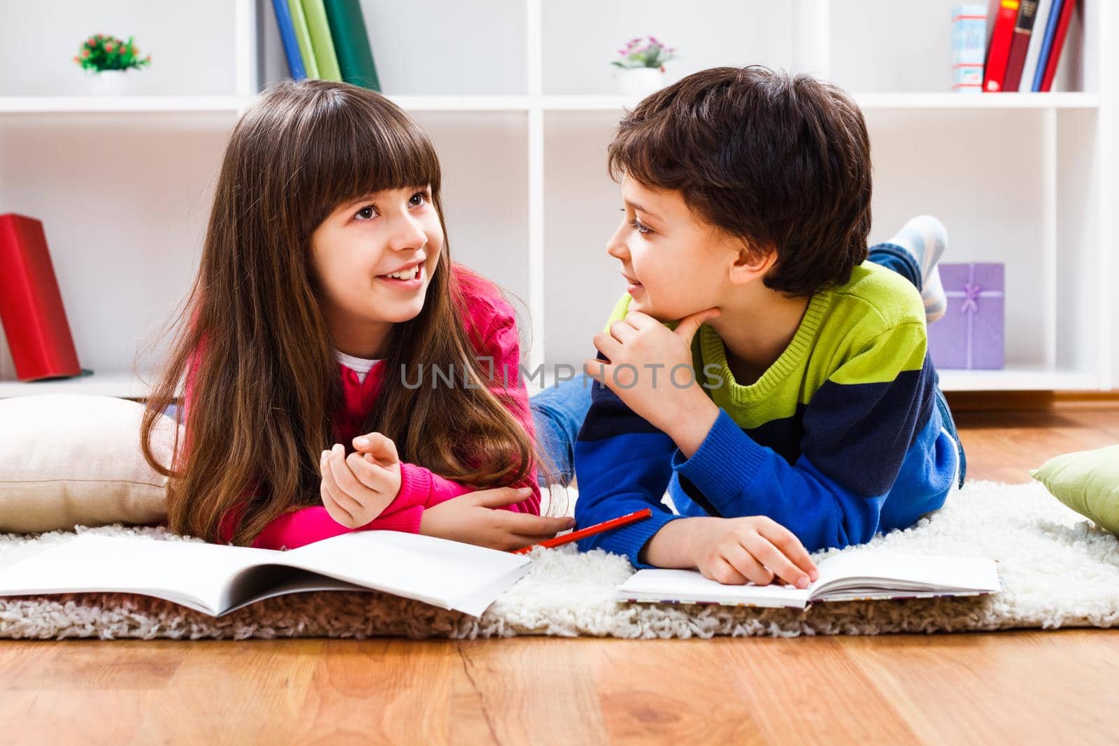 Image of children doing homework and talking.