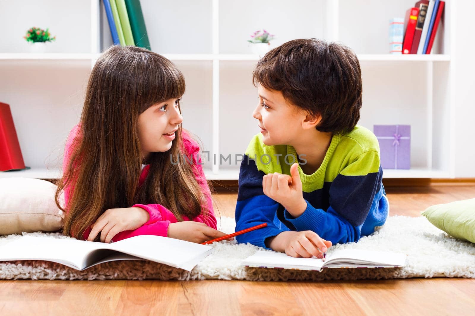 Image of children doing homework and talking.