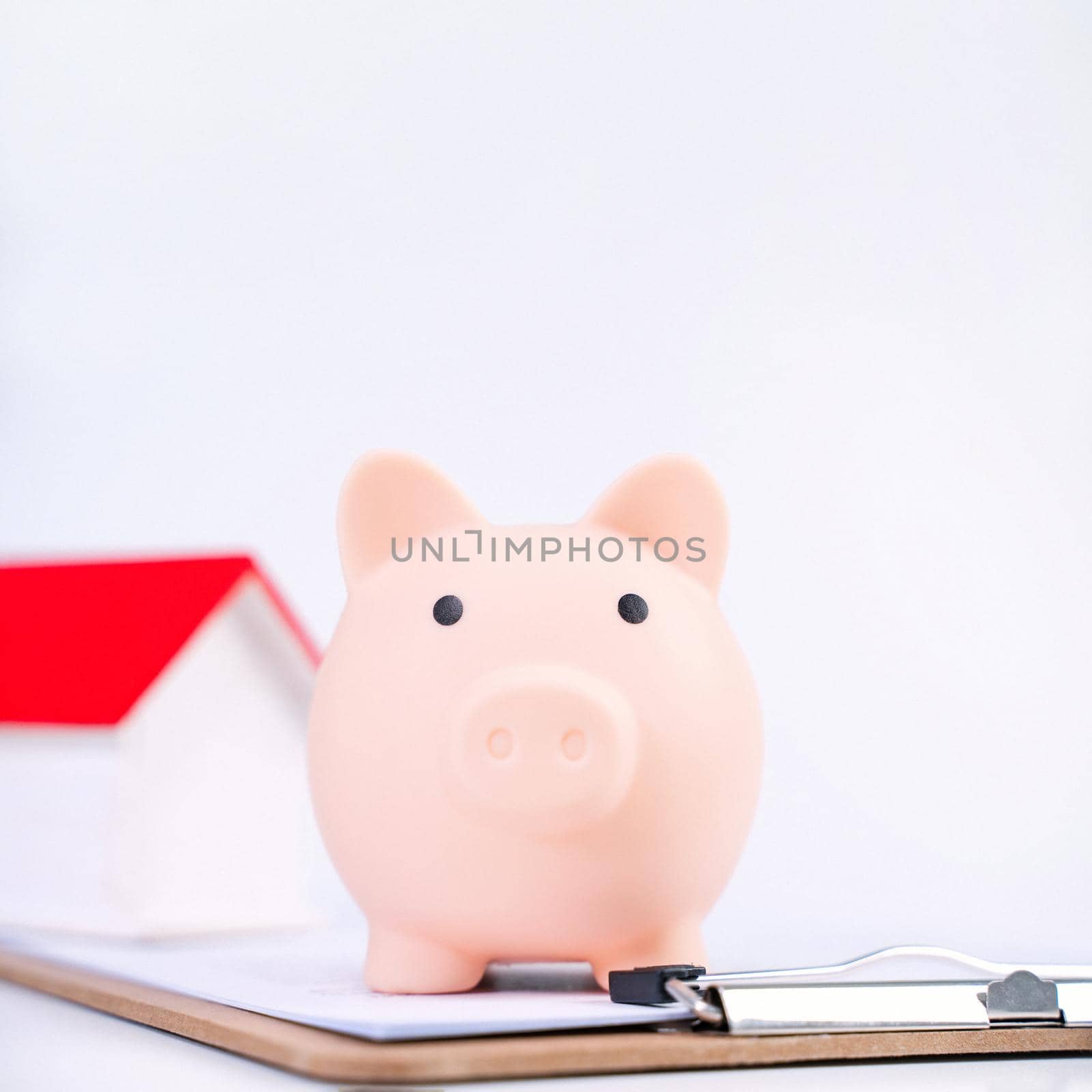 Financial concpet - Deposit box, Piggy bank, beautiful model on white background, saving money to pay for loan or insurance, close up, copy space. by ROMIXIMAGE