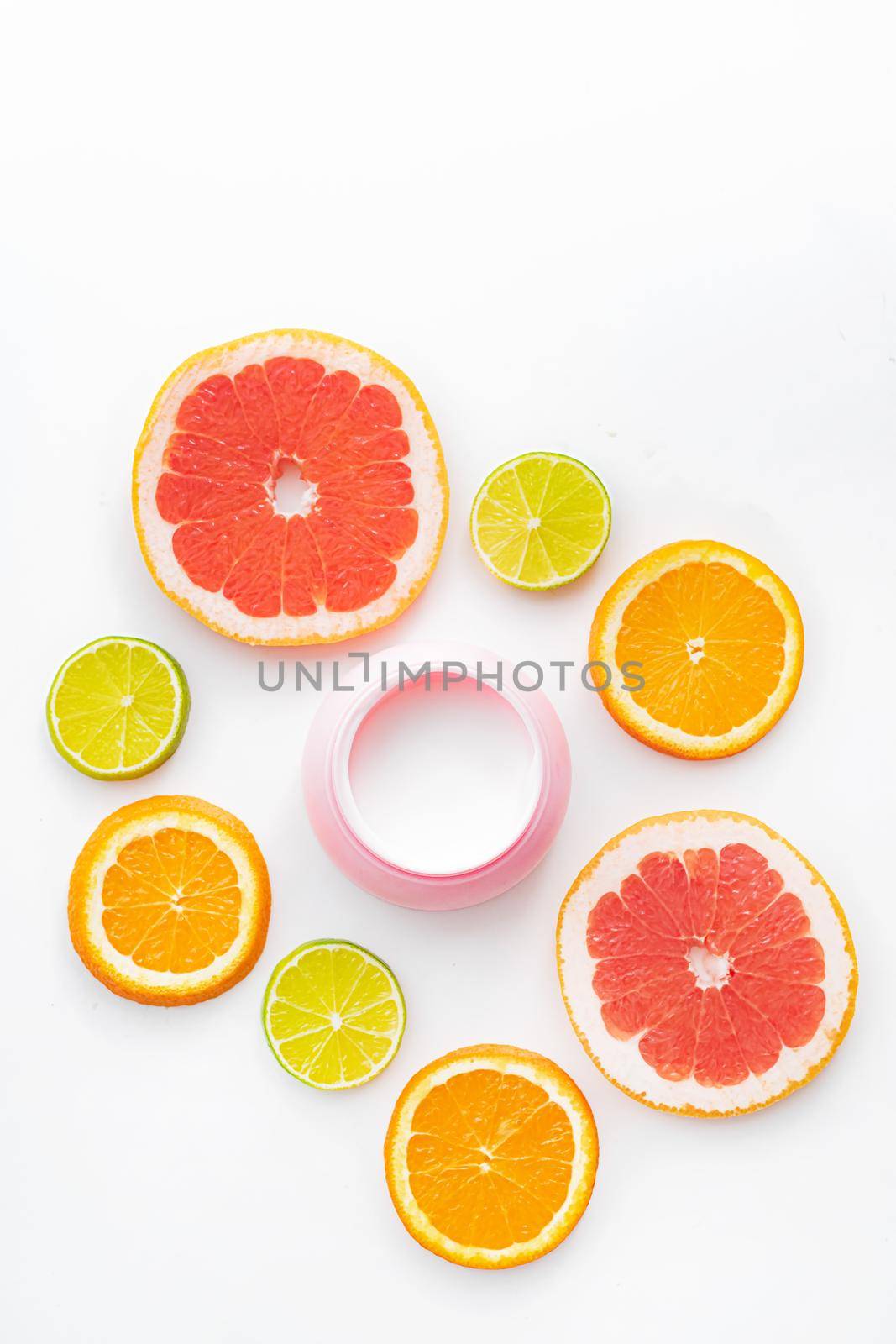 Cream and citrus fruits . Skin care. Citrus-based cream. White background. copy space