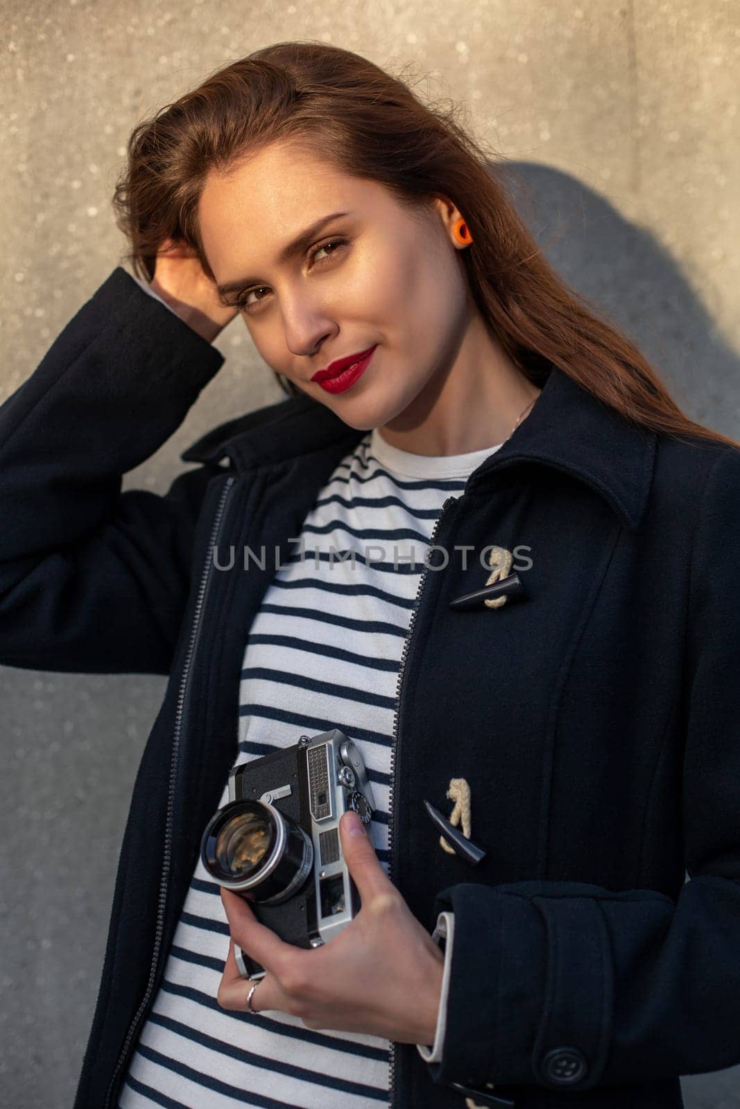 Lifestyle sunny fashion portrait of young stylish woman walking on street, with camera, smiling enjoy weekends, make a photo of her travel, old retro photocamera, vintage