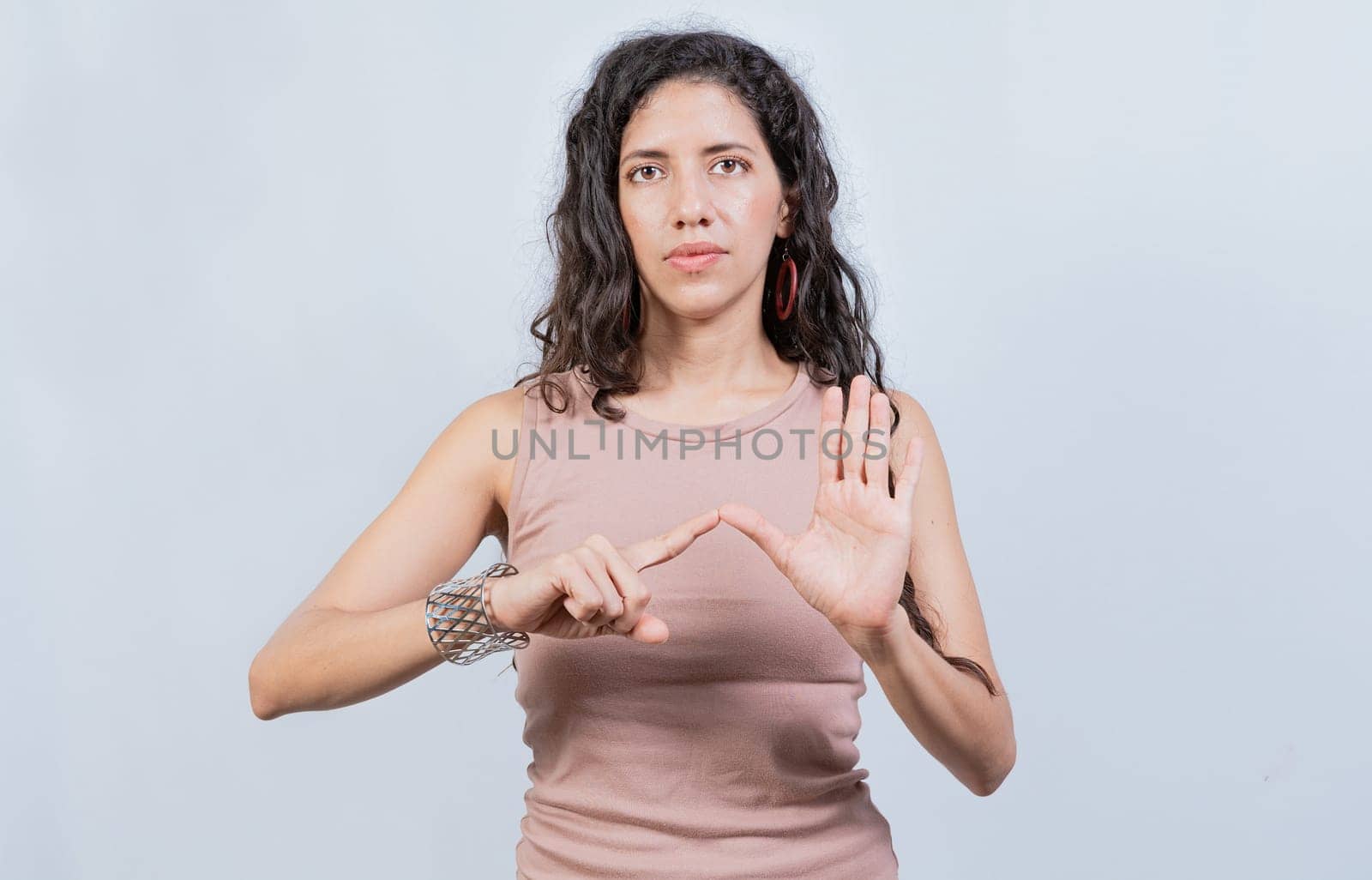 Lating girl gesturing in sign language isolated. Young woman gesturing in sign language, People speaking in sign language isolated