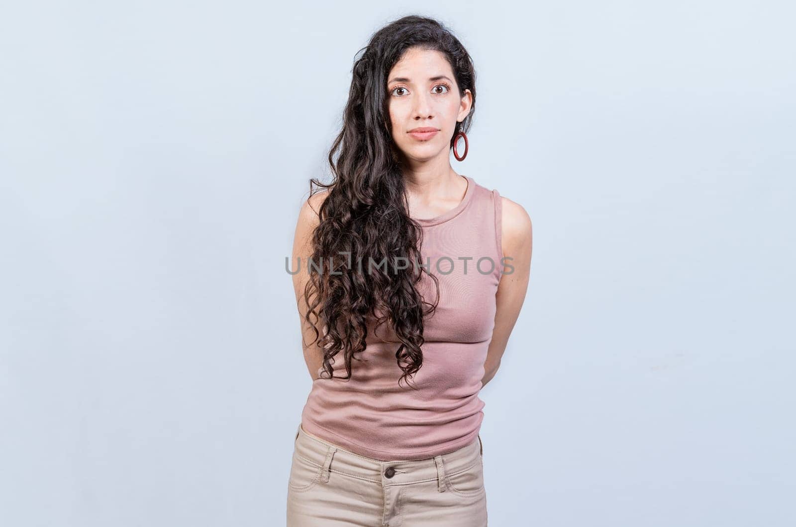 Portrait of attractive latin girl isolated. Young pretty latin girl with serene look on isolated background. Nicaraguan woman concept in isolated background by isaiphoto