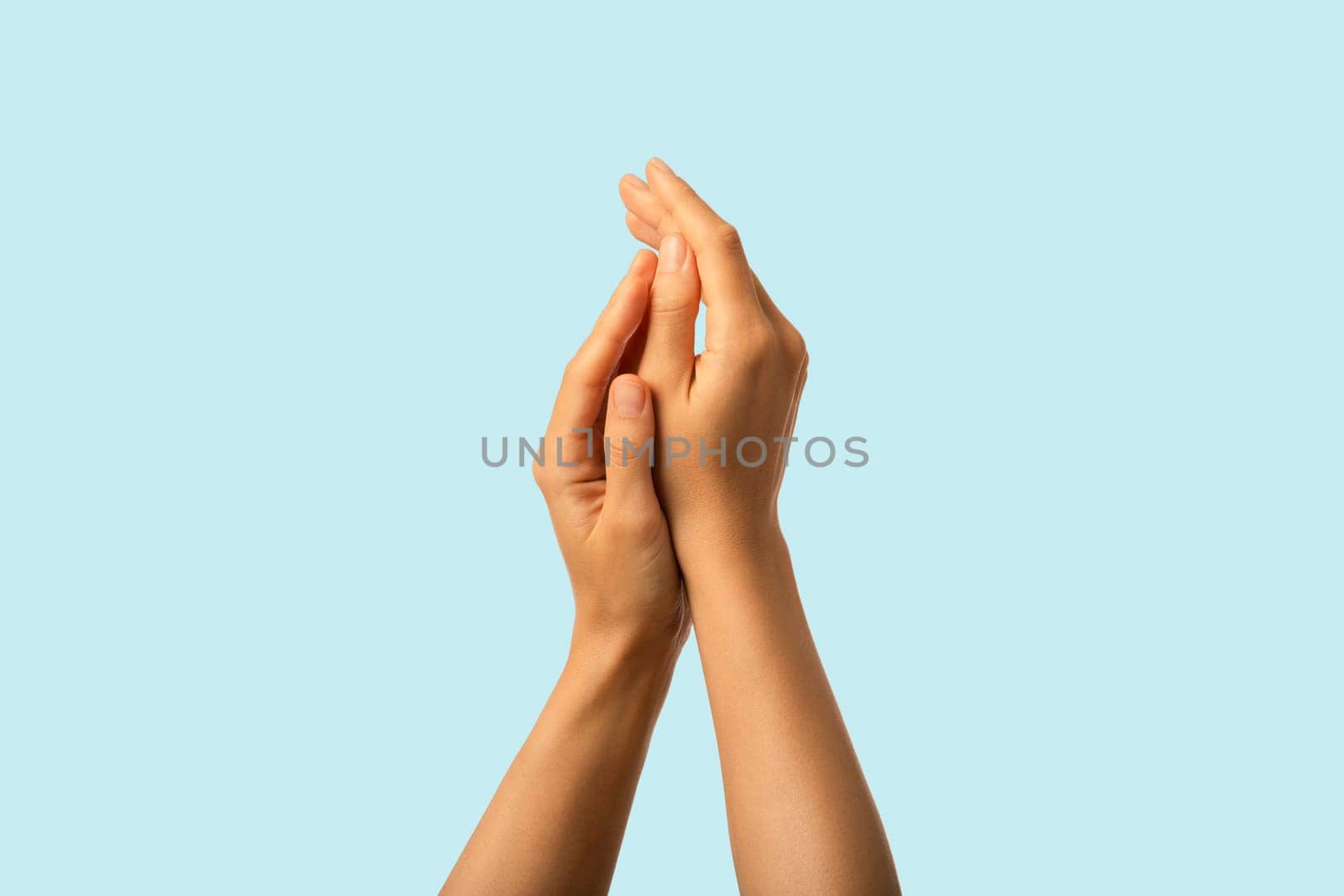 Skin protection and care. Beautiful soft moisturized female hands closeup.