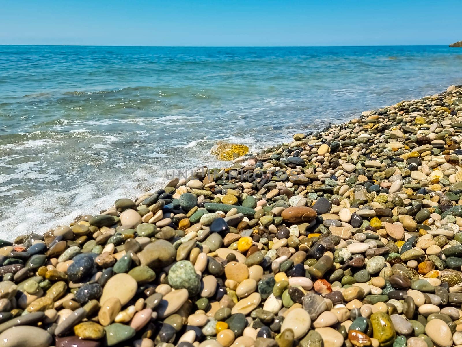 Stones on beach and sea water