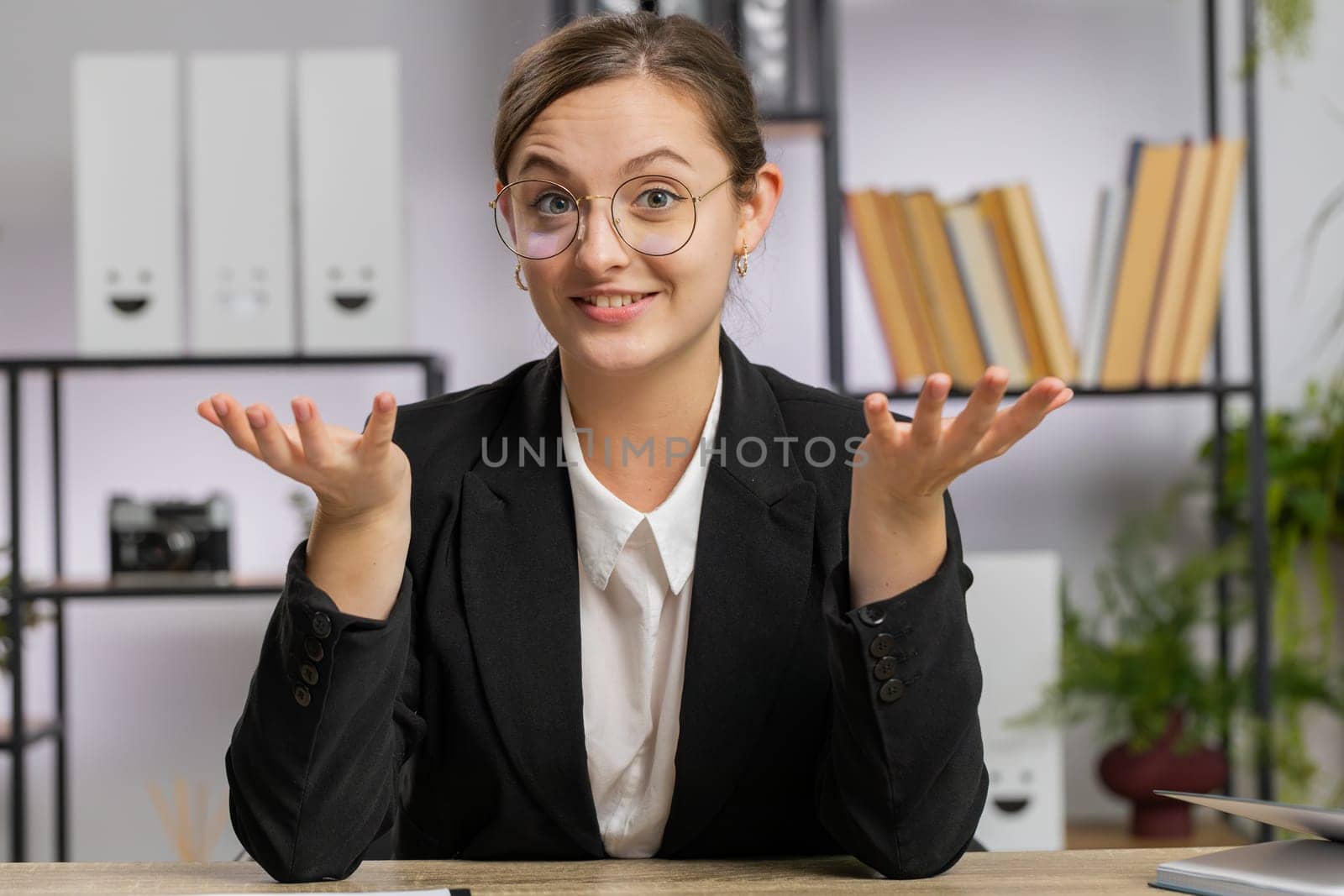 POV of Caucasian business woman working on laptop at office desk talk on online communication video call with employee, boss, teacher. Freelancer girl support services looking at camera. Webcam view