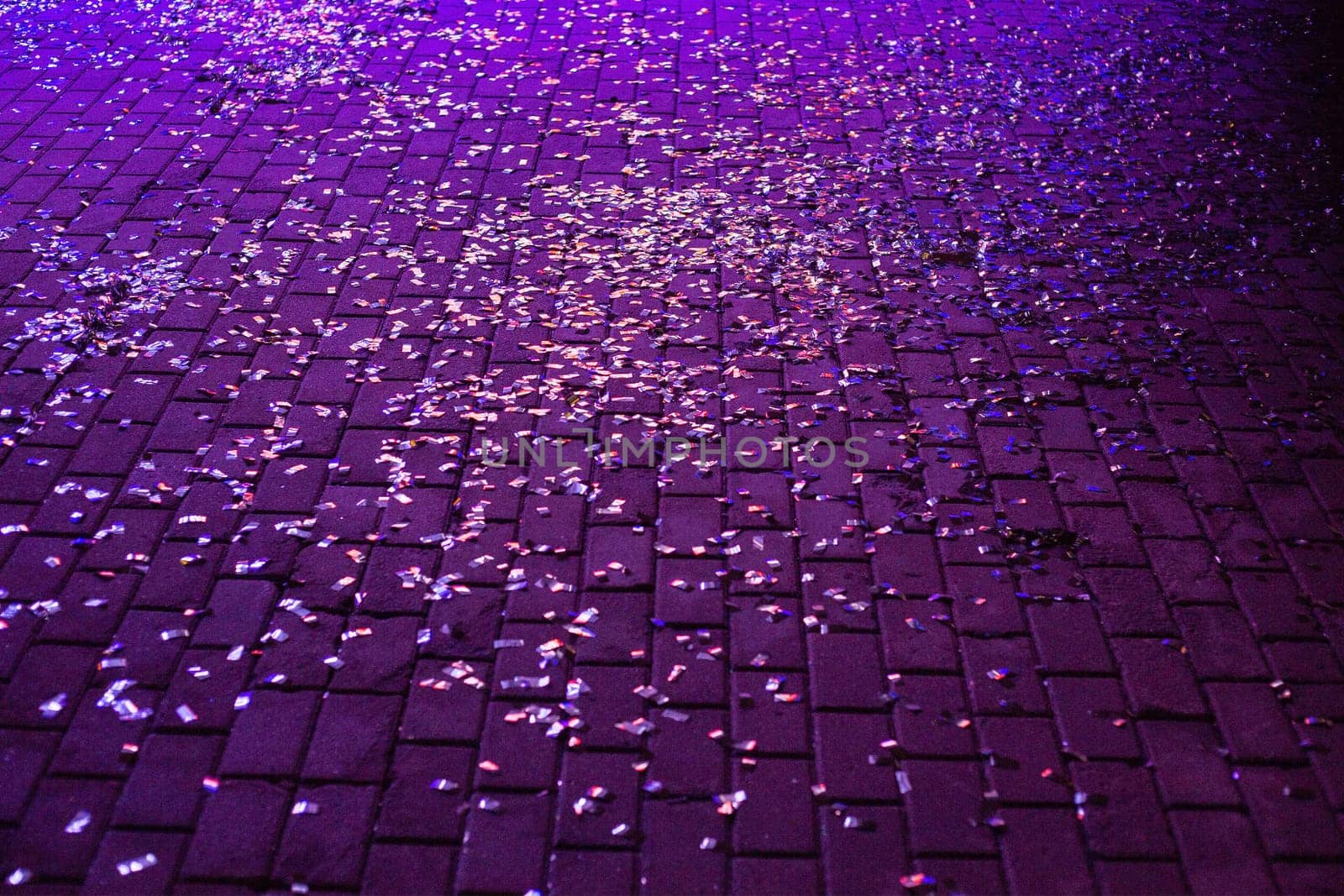 Scattered confetti on the square of stones. by gelog67