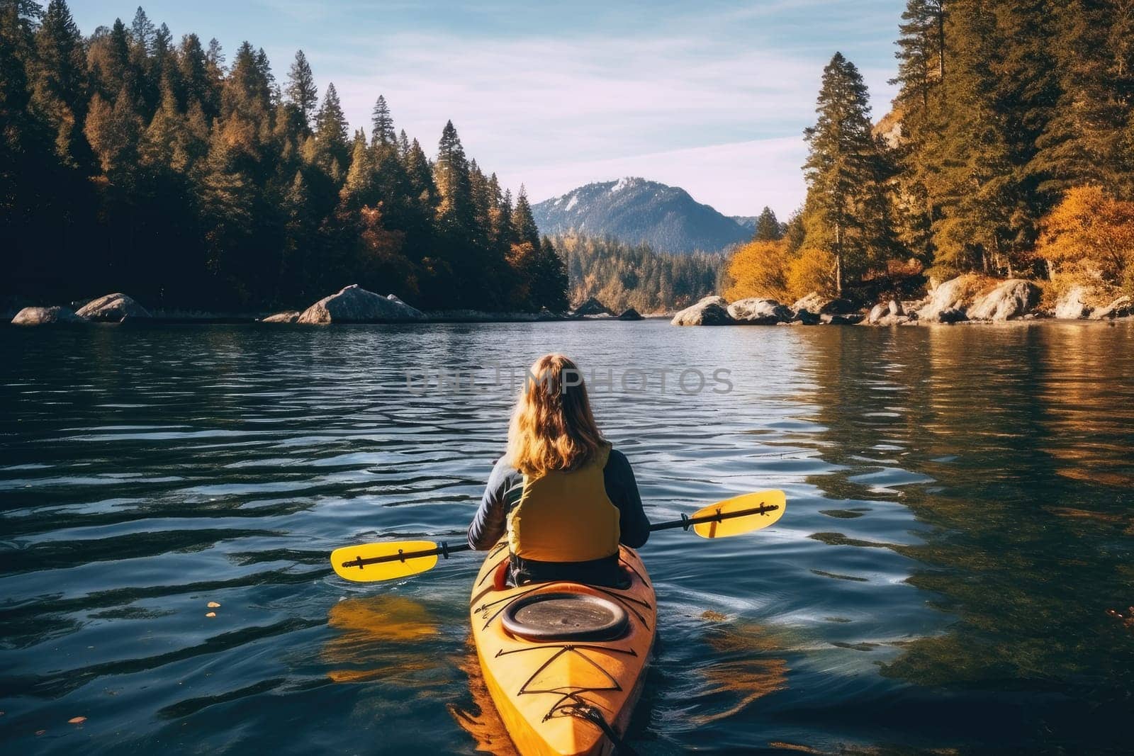 Rear view of woman kayaking at mountain lake. AI Generative by Desperada