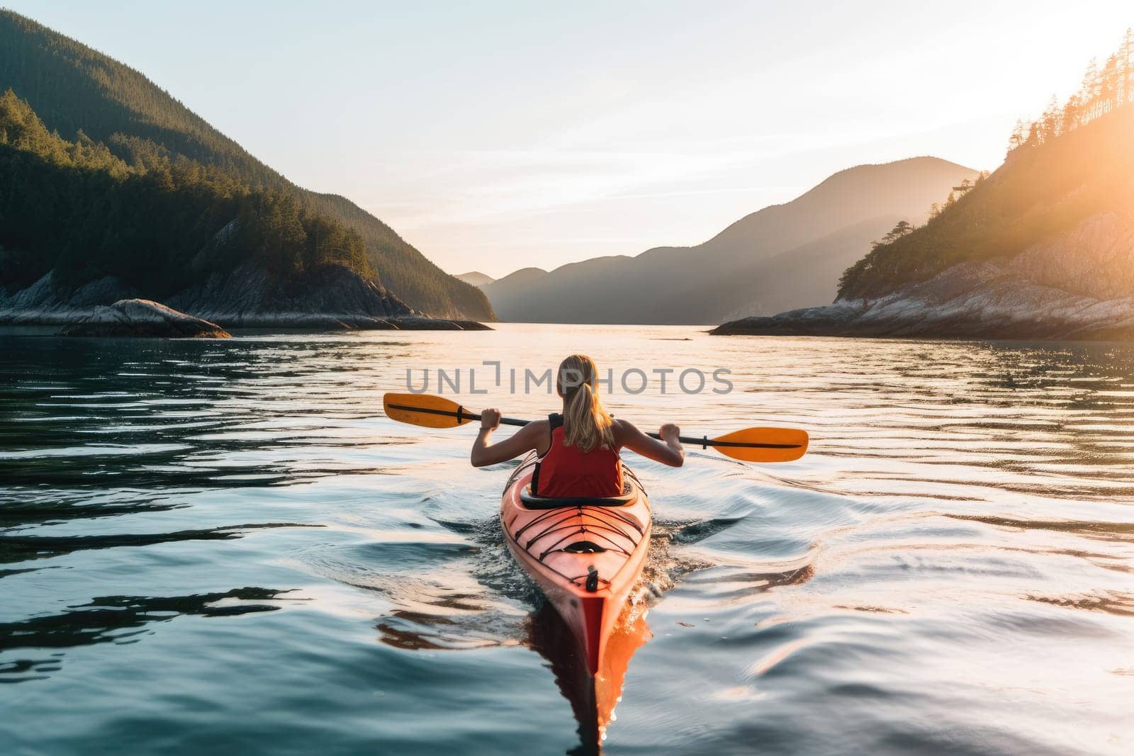 Rear view of woman kayaking at mountain lake. AI Generative by Desperada