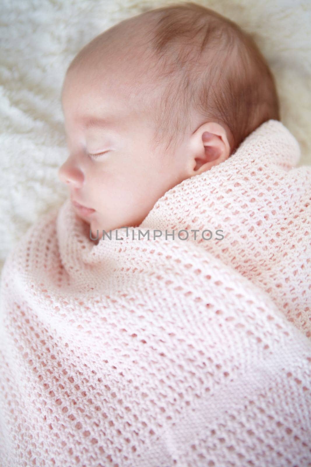 Baby, closeup and sleeping on bed, blanket and tired in profile in family home for growth, peace and comfort. Newborn infant girl, exhausted and childhood development in nursery, bedroom and house.
