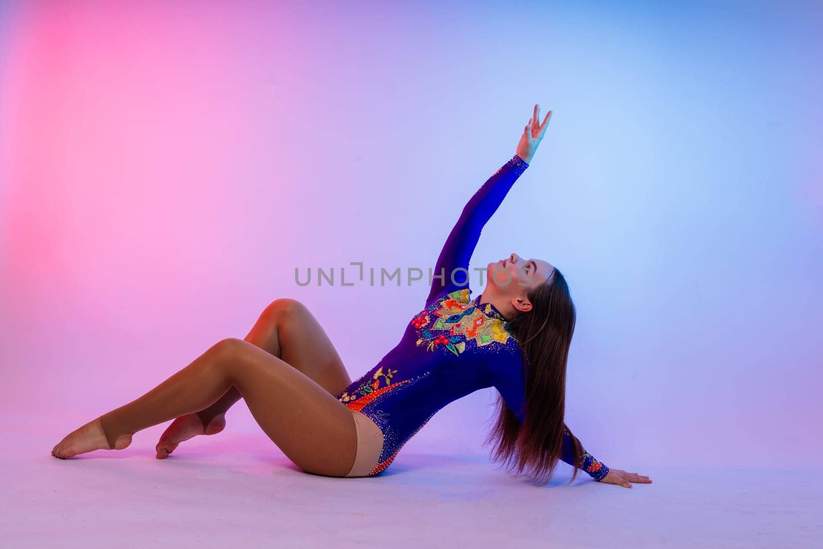 Full length portrait of plump woman doing physical exercise, jump, white and black background.