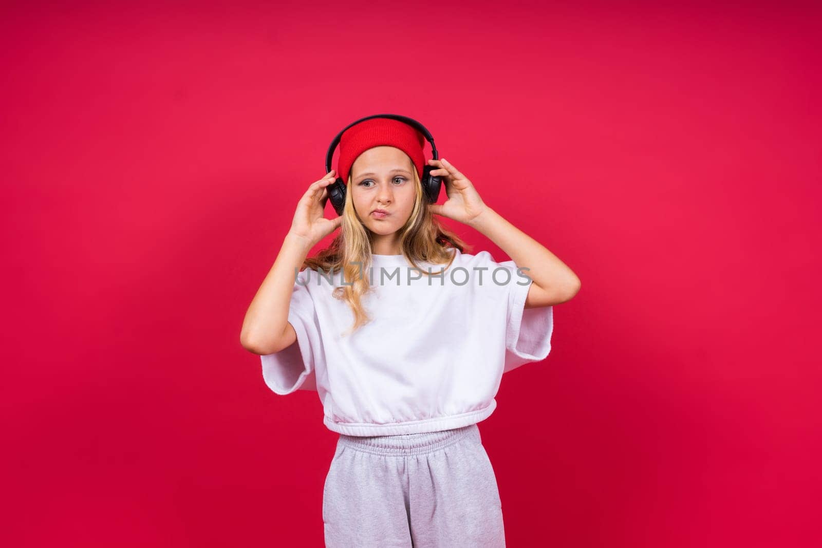 Little kid girl 12,13, 14 years old isolated background. Happy teenager, positive and smiling.