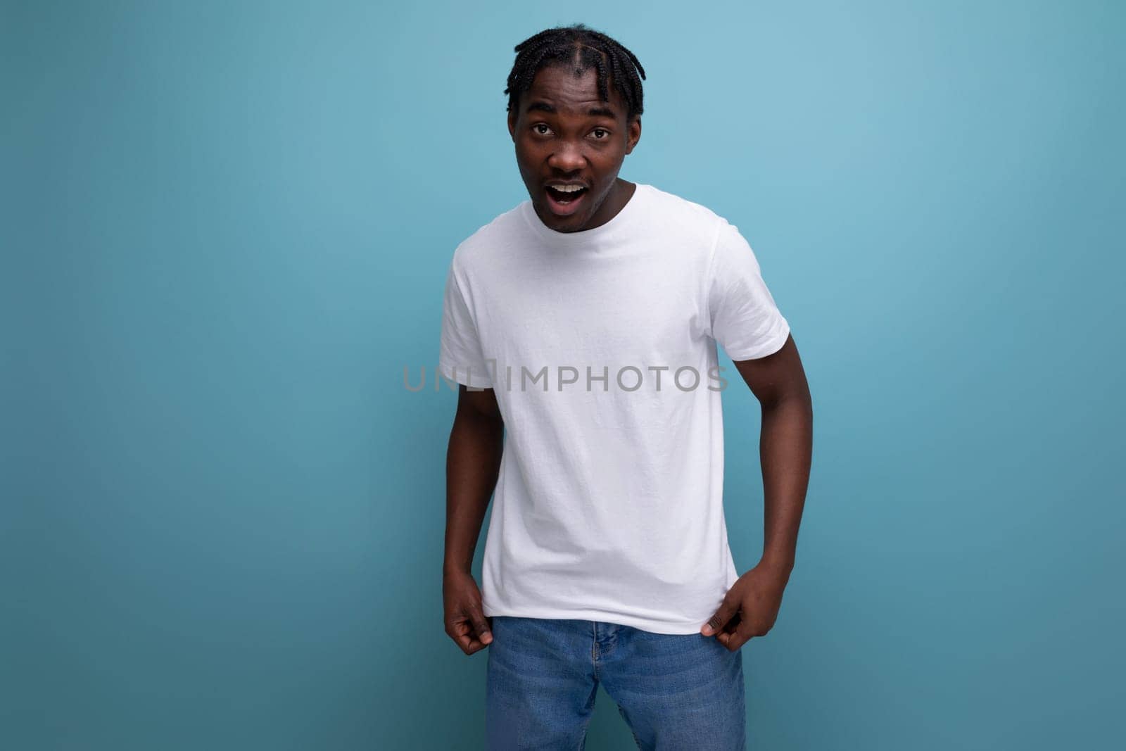 stylish young man with dreadlocks in a white t-shirt with empty space for logo.