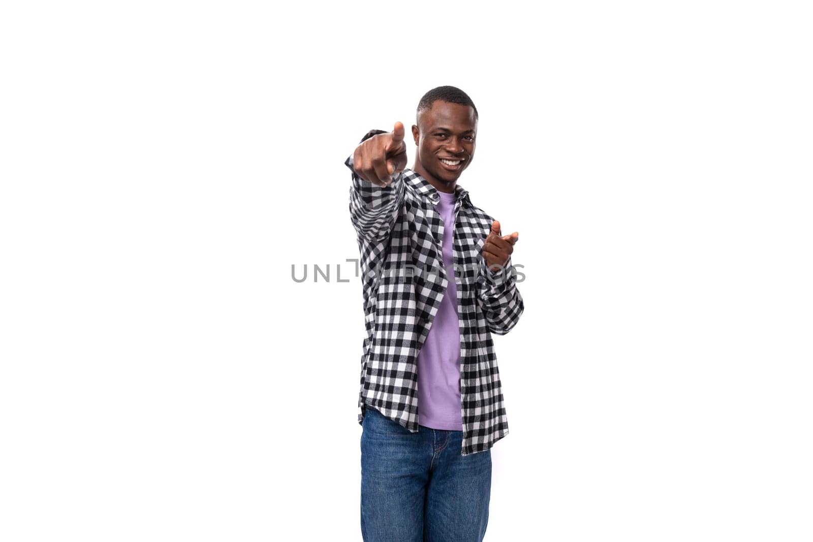 stylish young american guy with short haircut dressed casually on white background with copy space.