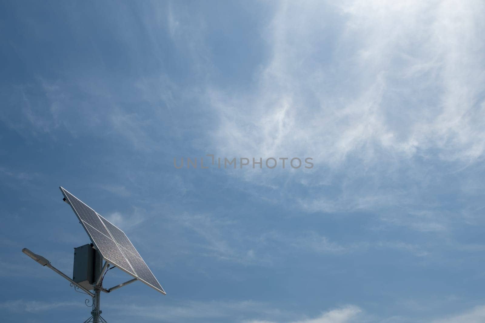 solar panel against blue sky with clouds. Solar energy panel. by igor010