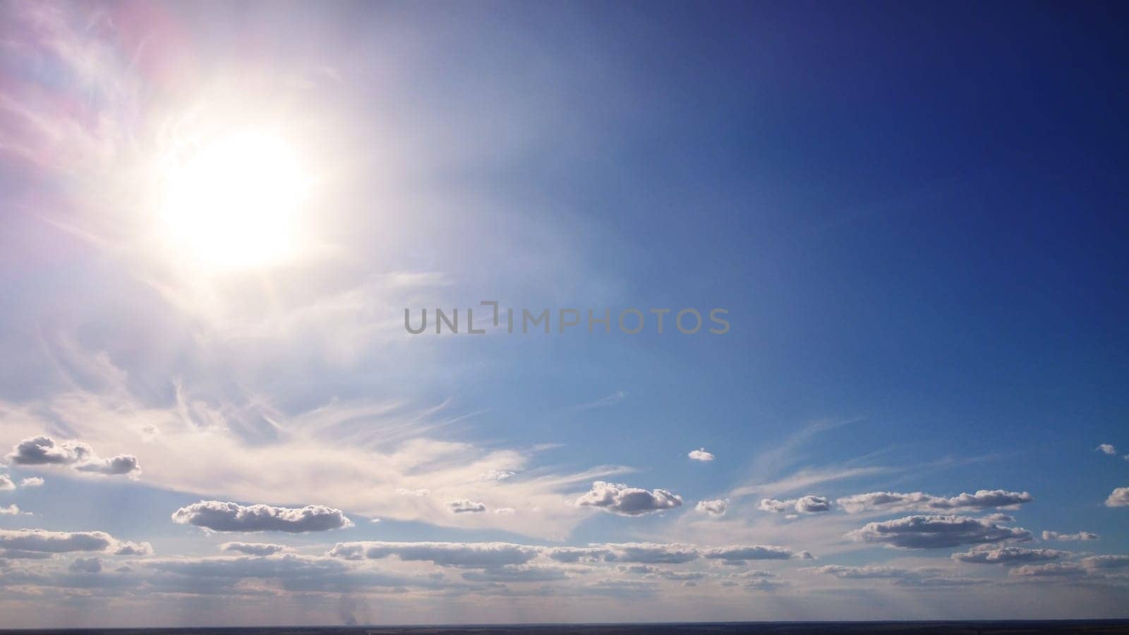 view of panorama blue sky with clouds and sun reflection. beautiful clouds