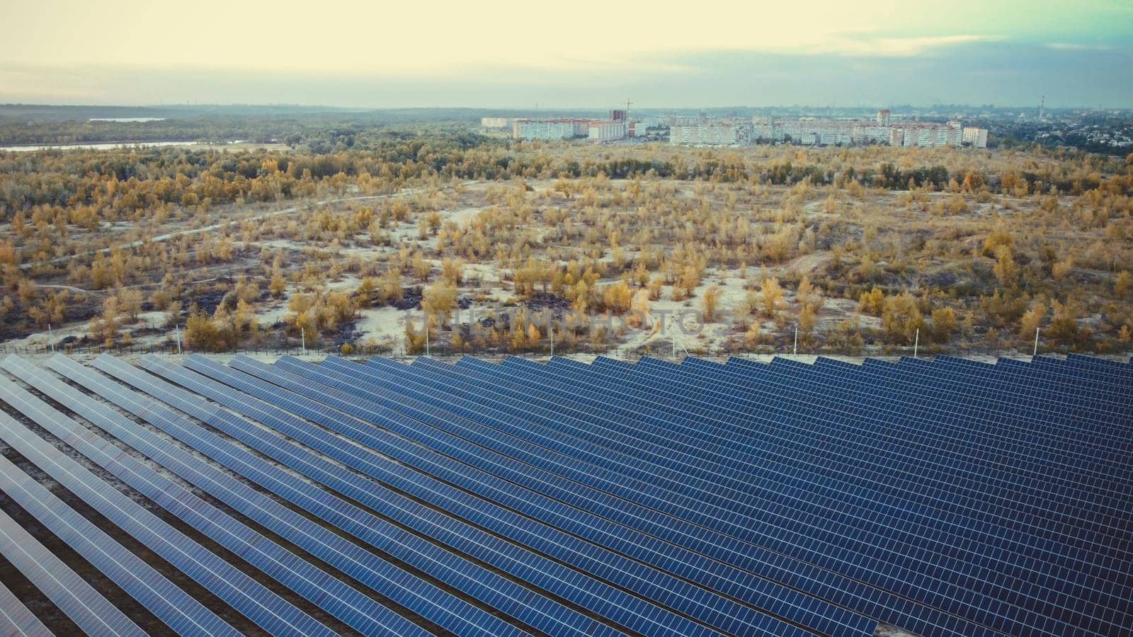 Solar panels far from the city. aerial view on solar panels. ECO city concept. solar panel