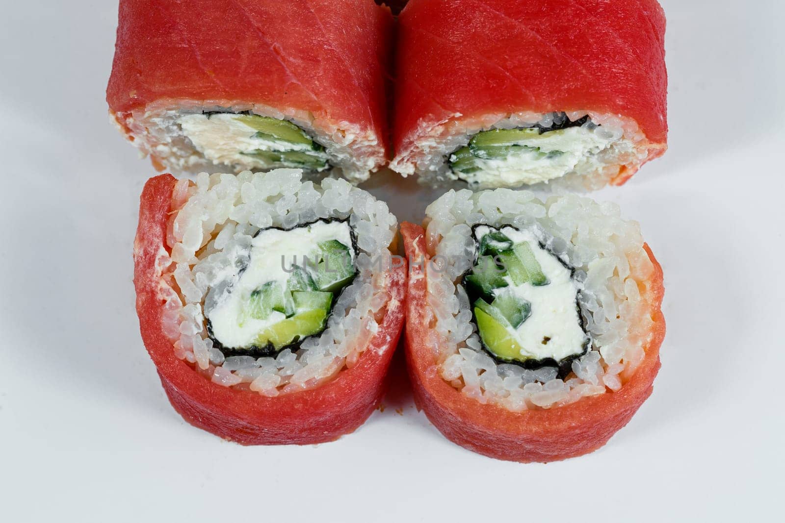 Japanese traditional food. Philadelphia sushi rolls with fresh avocado caviar and cream cheese and smoked salmon