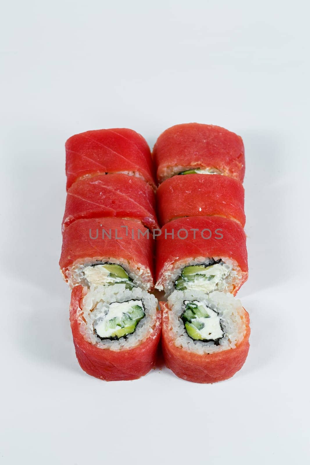 Japanese traditional food. Philadelphia sushi rolls with fresh avocado caviar and cream cheese and smoked salmon