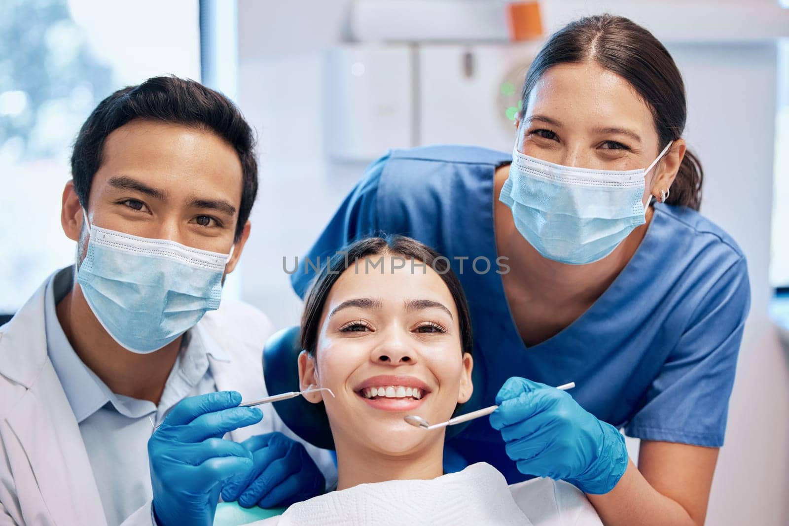 Portrait of dentist and woman in consultation for teeth whitening, service and dental care. Healthcare, dentistry and orthodontist with equipment for patient for oral hygiene, wellness and cleaning by YuriArcurs