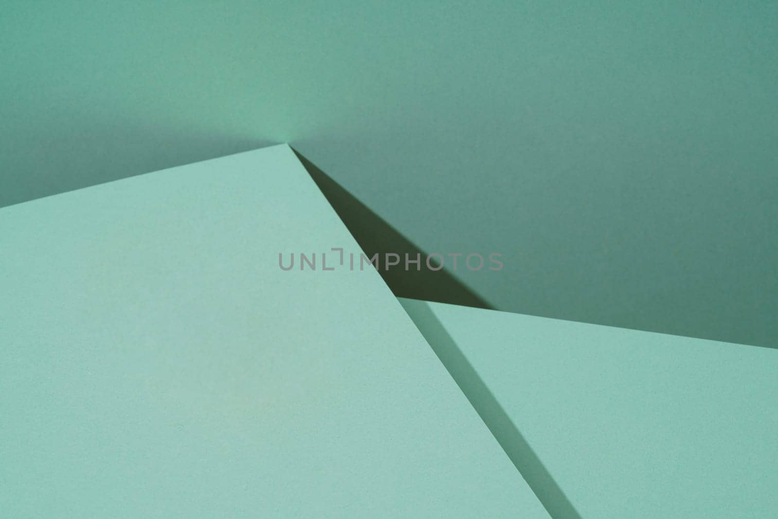 Colorful background from green paper with shadow. Abstract geometric by A_Karim