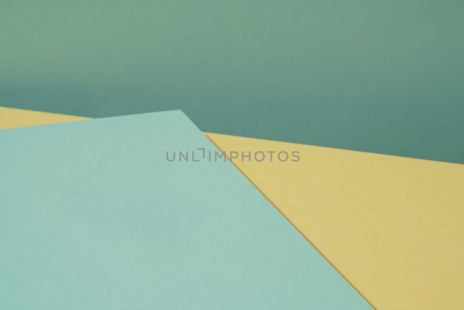 Colorful background from green and yellow paper with shadow. Abstract geometric by A_Karim