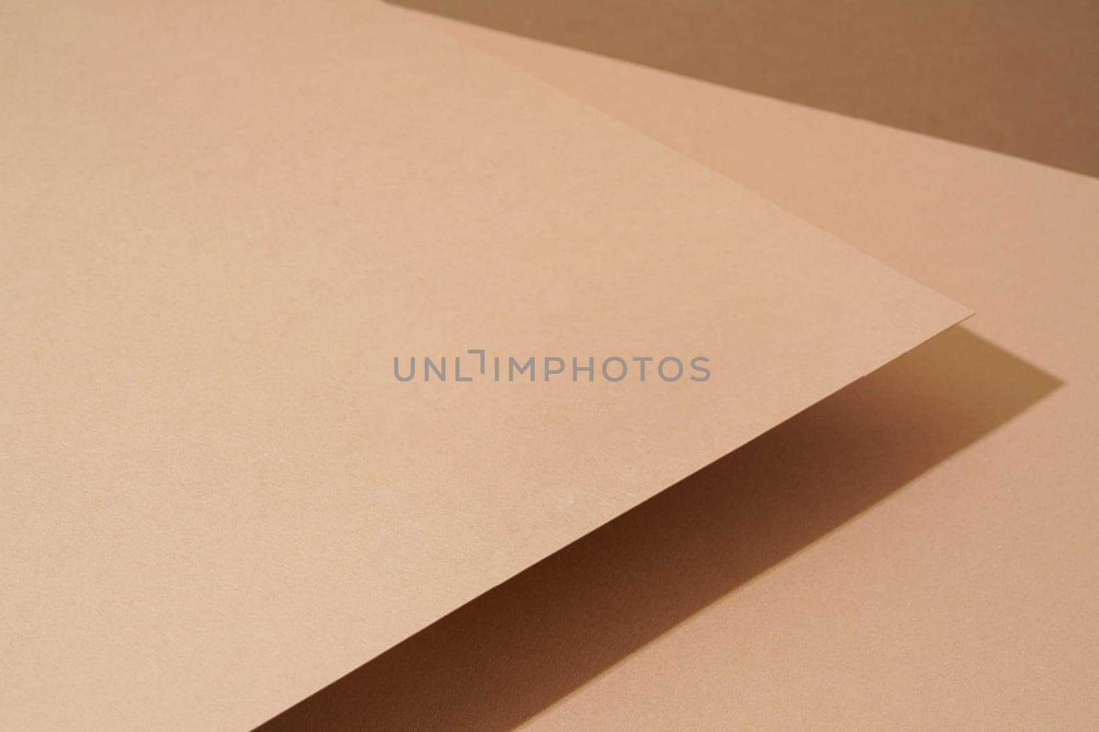 Colorful background from brown paper with shadow. Abstract geometric