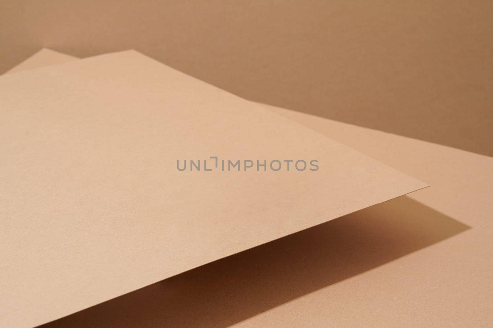 Colorful background from brown paper with shadow. Abstract geometric